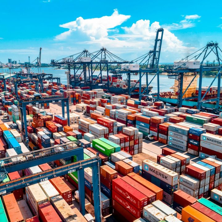 a large amount of containers are stacked on top of each other