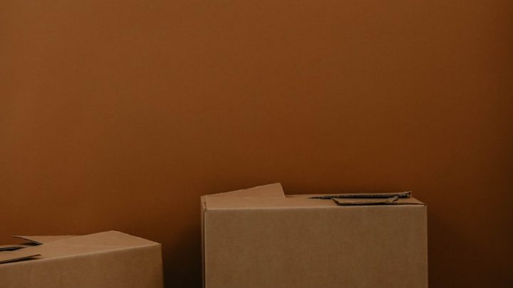 white cardboard box on brown wooden table