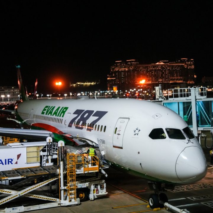 Eva air boeing 787 parked at airport gate at night